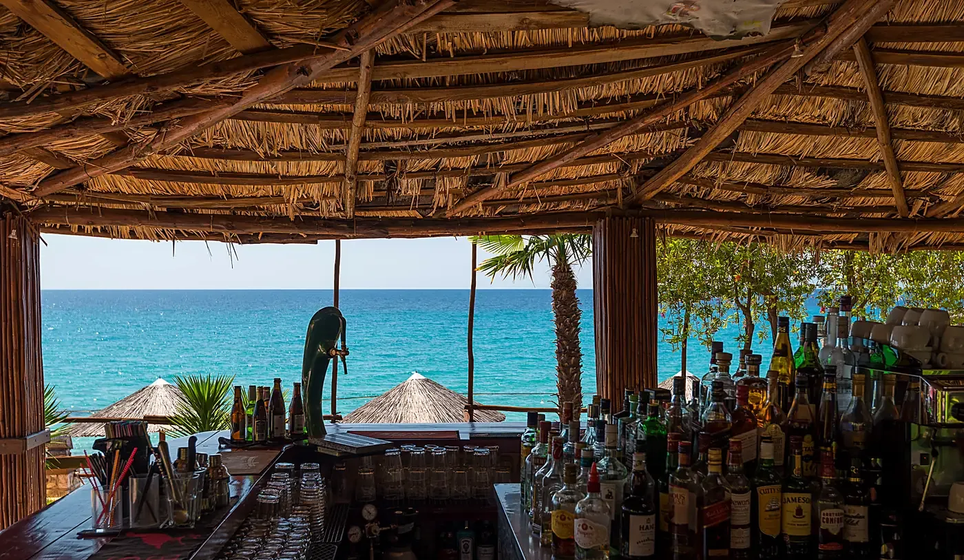 View over the bar counter, out to the turquoise Aegean